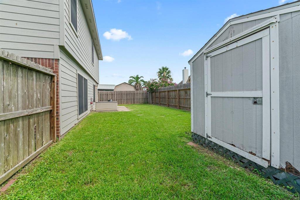 Back yard is fenced.  Storage shed is included.