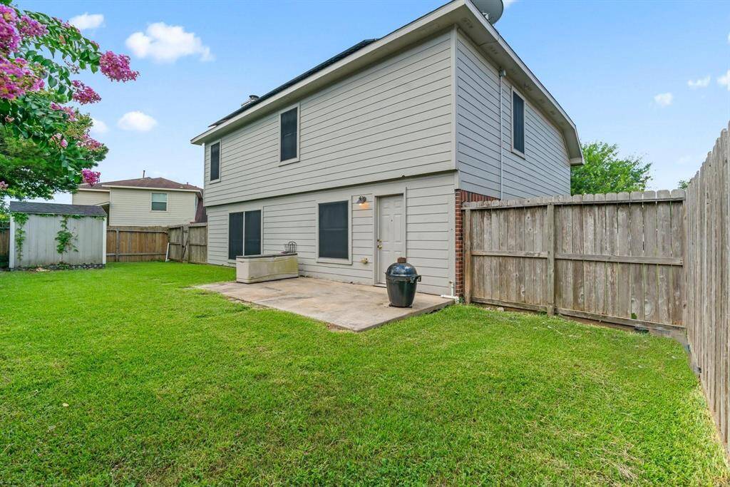 View of back yard, fenced