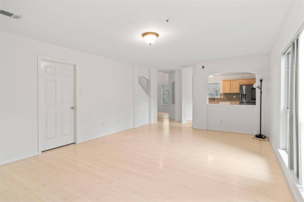 Large family room with access to the laundry room (left) half bath and garage.