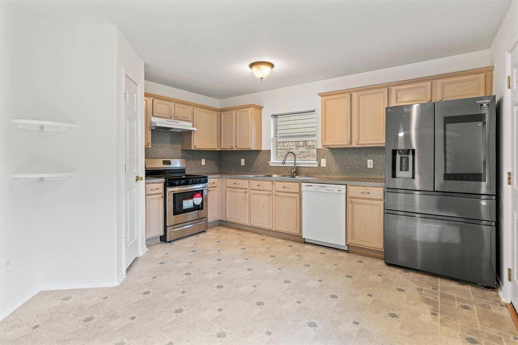Large kitchen has an abundance of storage space.  Recently added gas stove
