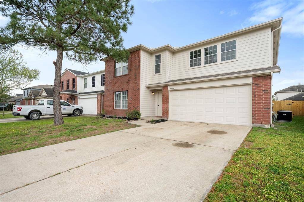 Long driveway with two car garage