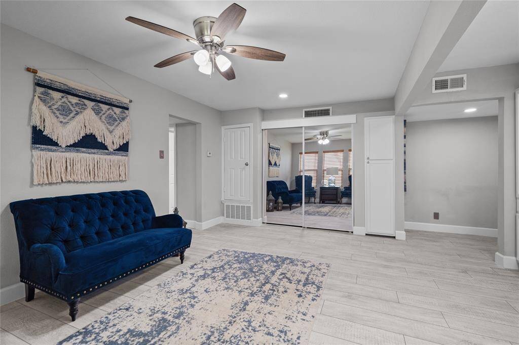 Another view of your living area and entryway. The sliding glass doors lead to a full sized washer and dryer. To the right of the sliding glass doors is another pantry for storage. There is also extra room and shelving in the utility closet with washer dryer for storage.