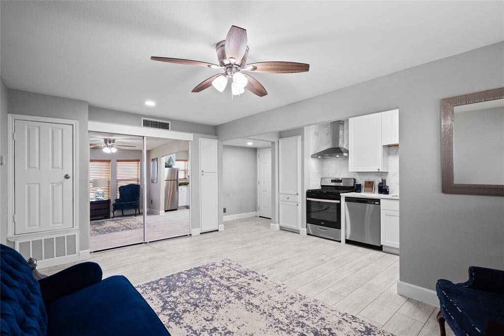 Another view of entryway, living/dining and kitchen area.