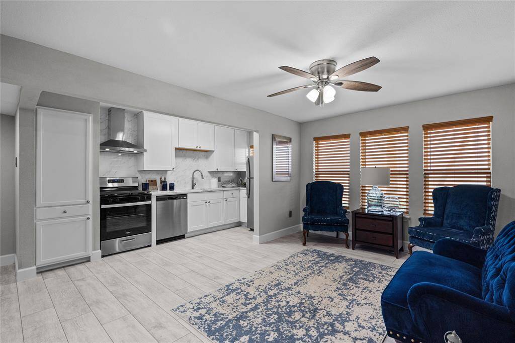 Another view of living/dining and kitchen area. Look at all those windows!!!