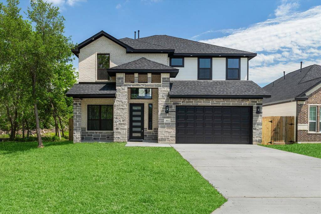 Welcome to 811 Easy St in La Porte, TX! This charming home boasts a covered front porch, a spacious two-car garage, and a double-wide driveway. The exterior is a beautiful blend of brick, Hardi Plank, and stone.