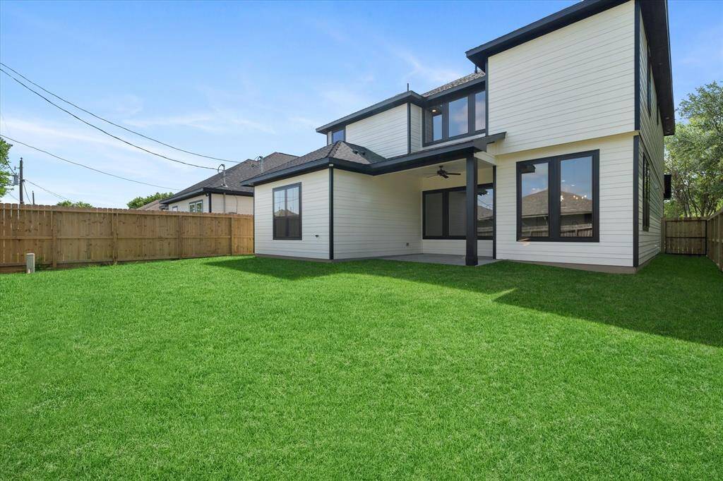 Step outside to a covered patio and expansive backyard, ideal for outdoor entertaining or relaxing in privacy—all beautifully positioned with one neighboring fence line.
