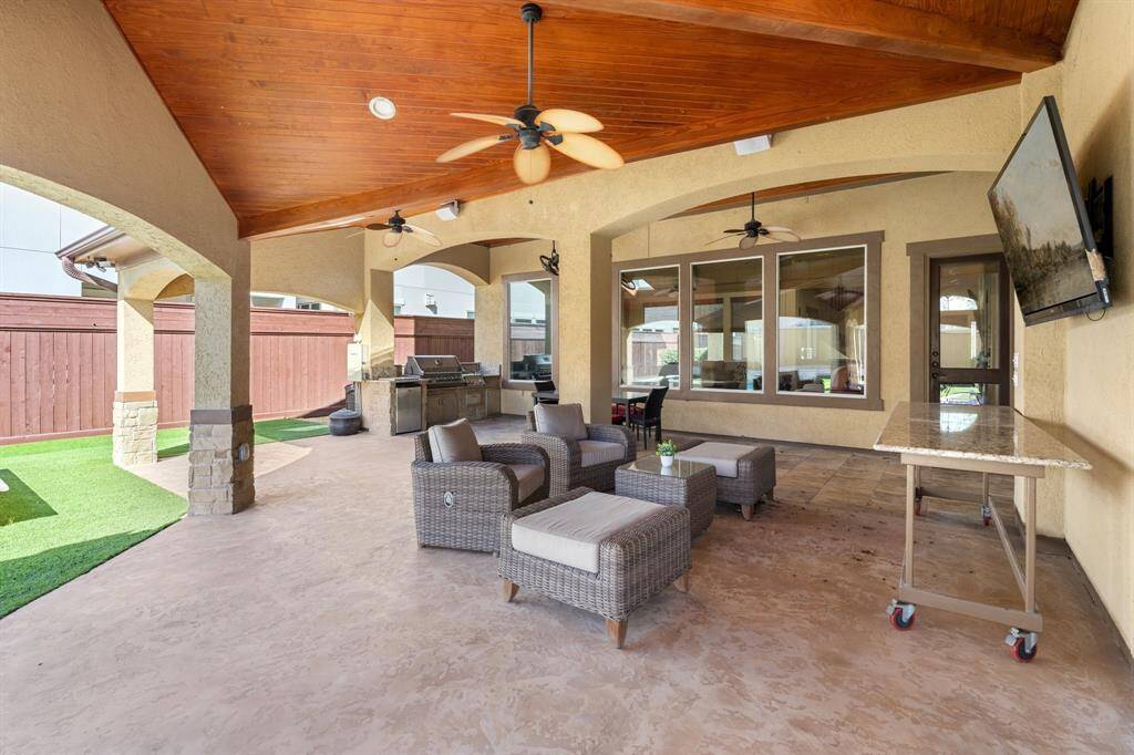 Incredible deck space, perfect place to relax and entertain! Note: the large custom granite table on wheels will remain as well as the bracket to hang your tv!