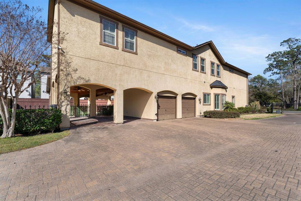 Attached 2 car garage with brick floors PLUS an attached 2 car carport are all inside the gated community offering ample parking!