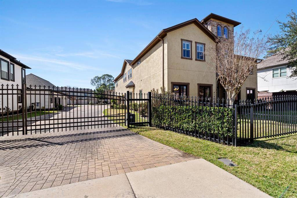 This rare gated community in the middle of Briargrove Park offers security with an automatic driveway gate that leads to this small community.  This home features a  2 car garage PLUS 2 car attached carport.