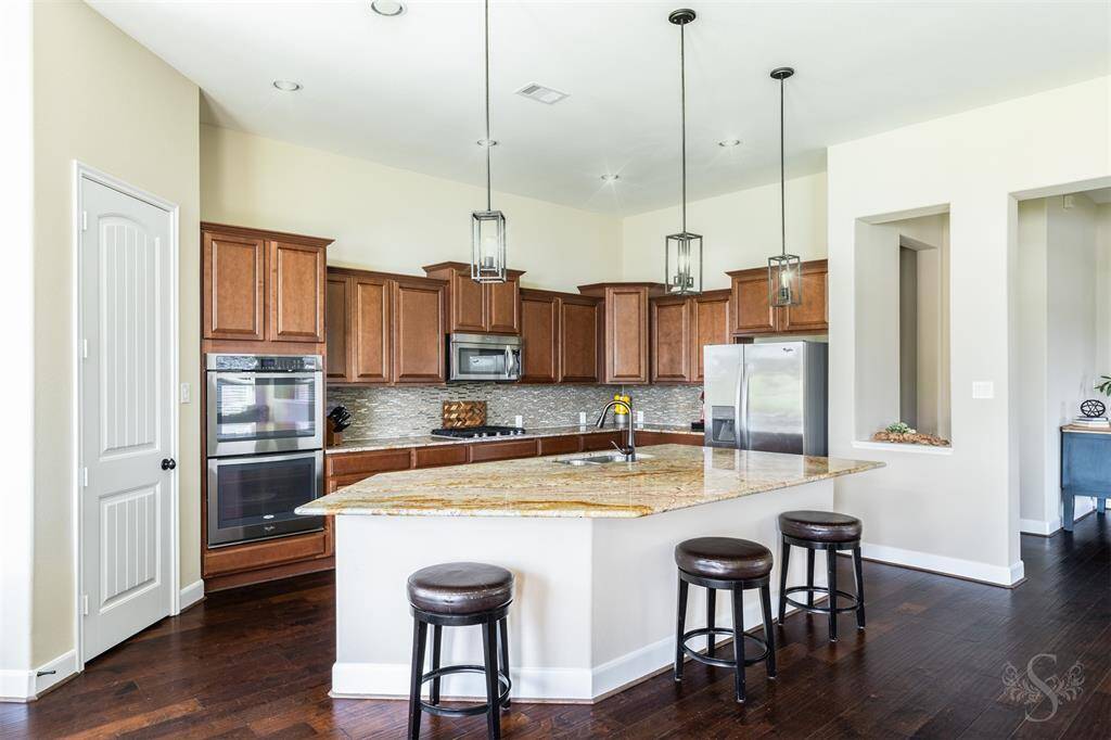 Loads of counter space and cabinets for storage.  There is a walk-in pantry and built-in microwave.