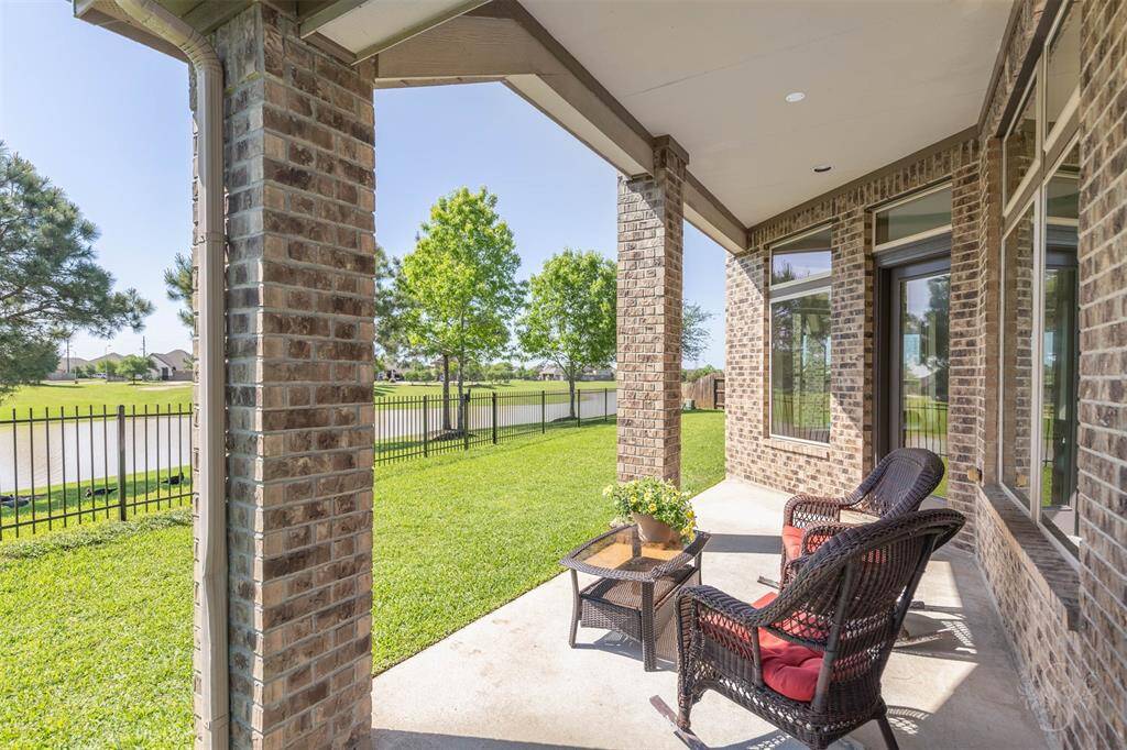 Covered patio overlooking the lake is pre-wired for fan.