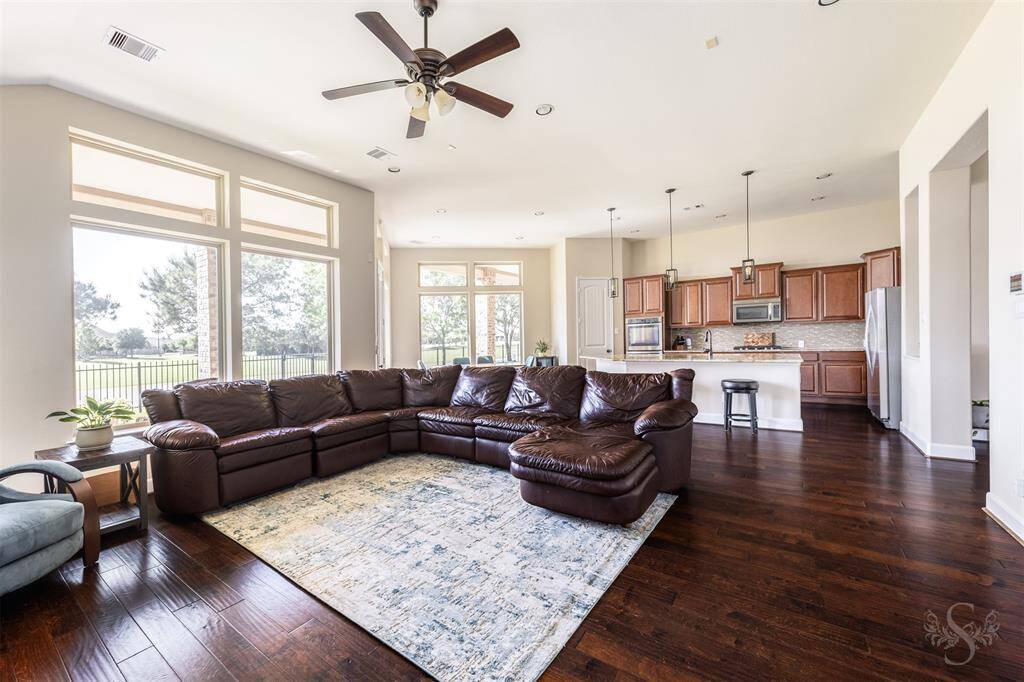 Wow!  Huge open concept kitchen and living area.  Views of lake and fountain from every window! Look at the light streaming in the large windows.