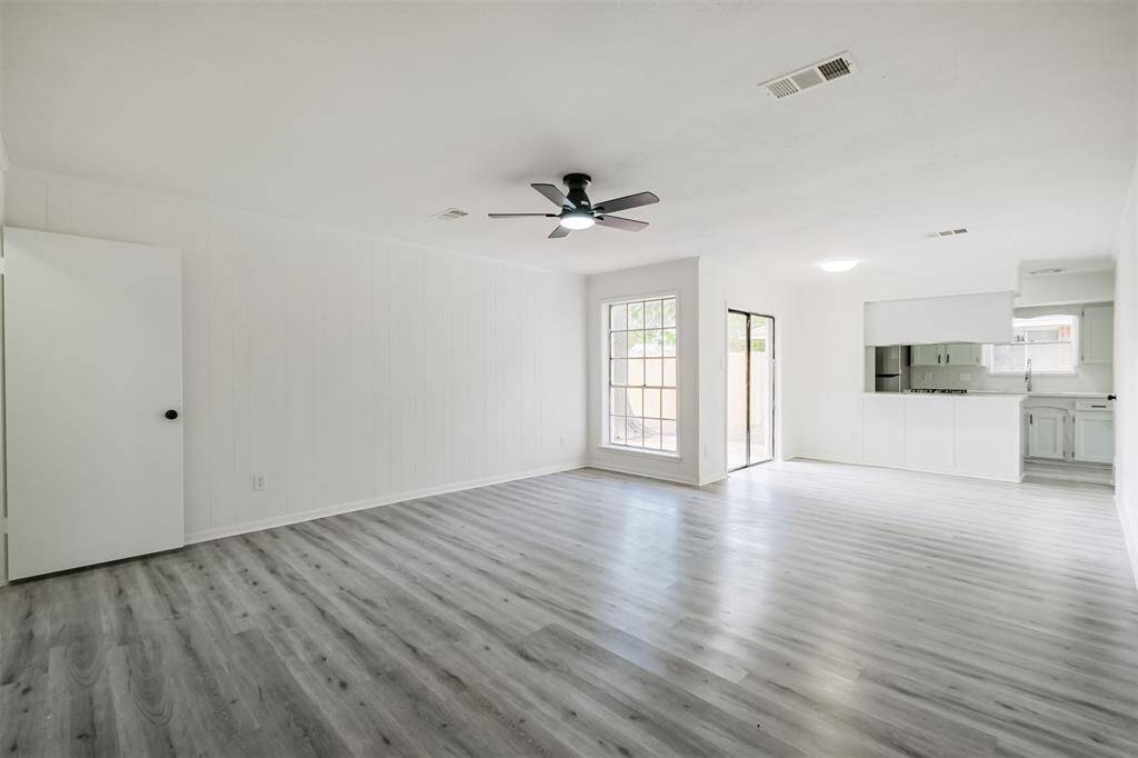 The family room seamlessly connects to the kitchen and features a sliding door that opens onto the patio.