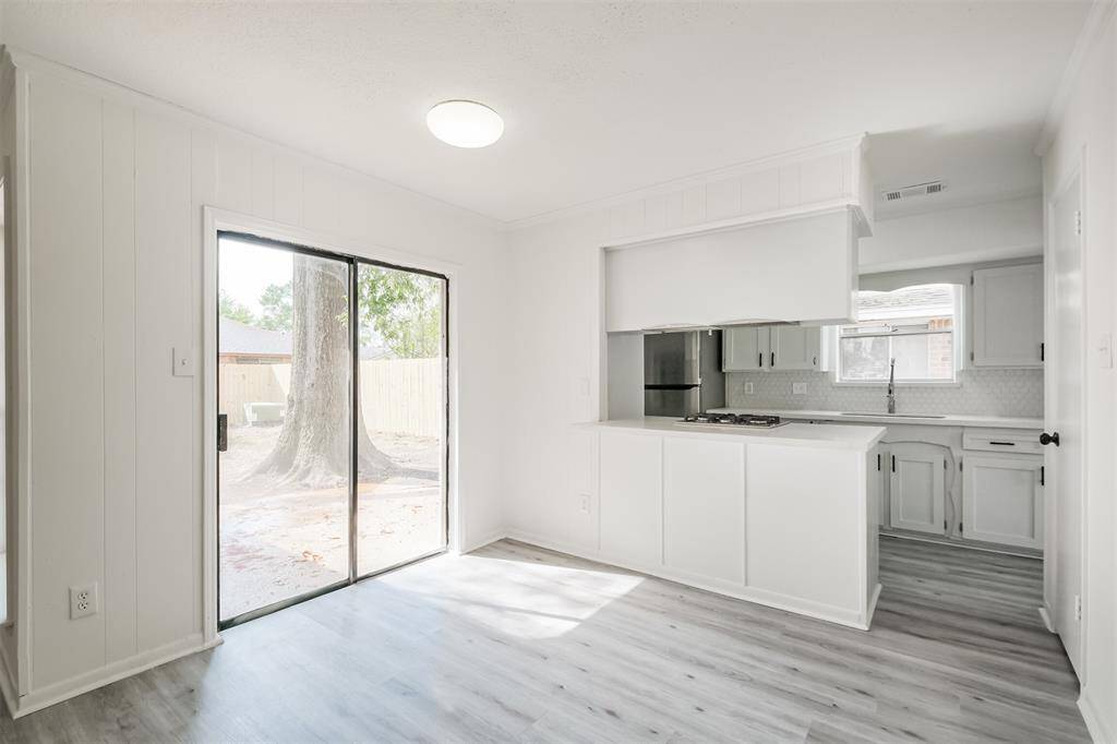 Breakfast nook featuring a sliding door that opens to the patio.