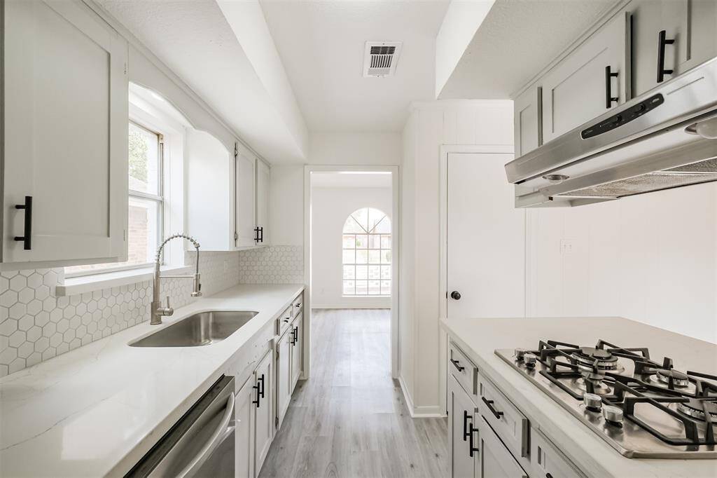 The kitchen seamlessly connects to the formal dining area.