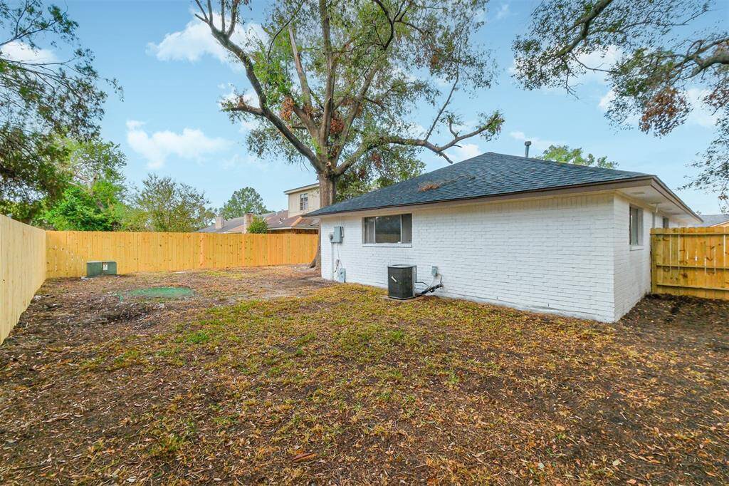Enclosed back yard with a new fence.