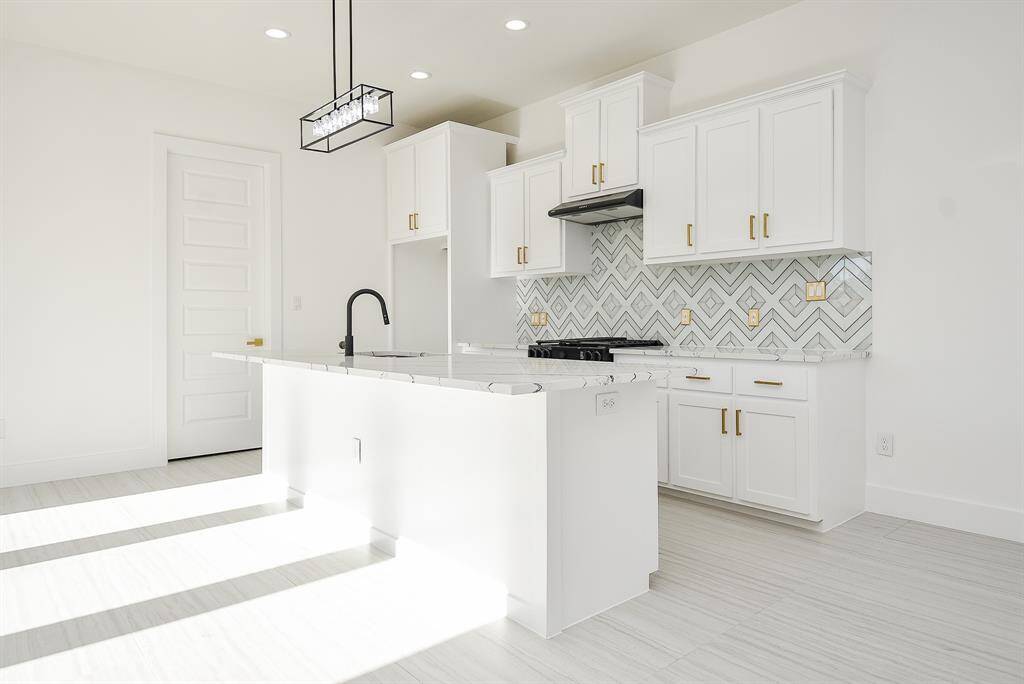 Ample built-in custom cabinetry provides plenty of storage.