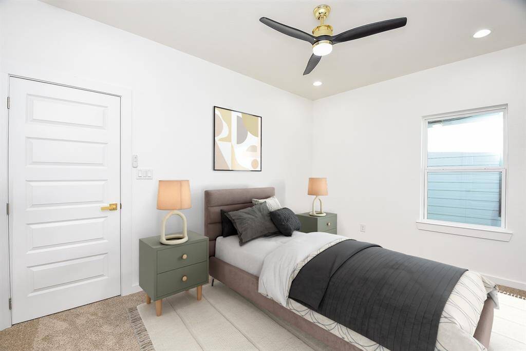 Spacious walk-in closet in the secondary bedrooms, offering ample storage with built-in shelving and double hanging rods. Designed for both functionality and organization.