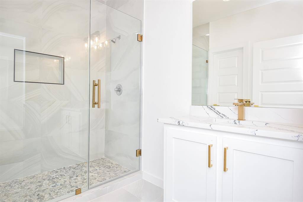 This inviting secondary bedroom features a neutral palette, plush carpeting, and ample closet space. With recessed lighting and a modern ceiling fan, it offers a comfortable and stylish retreat.