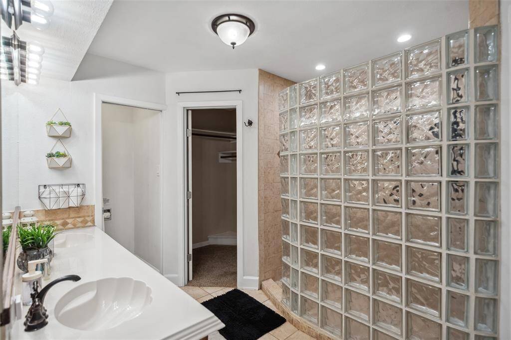 Primary bath with large shower and double sinks.