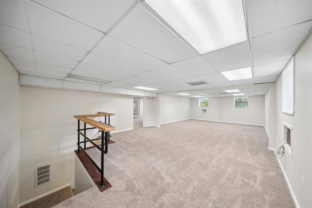 As you walk up the stairs, you will find an open space that has been freshly painted and new carpet installed throughout the entire unit.