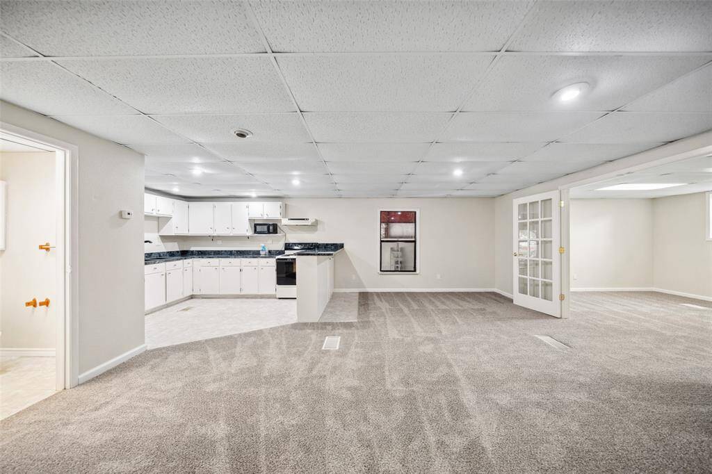 The other room upstairs in the building has a large living space and fully equipped kitchen.