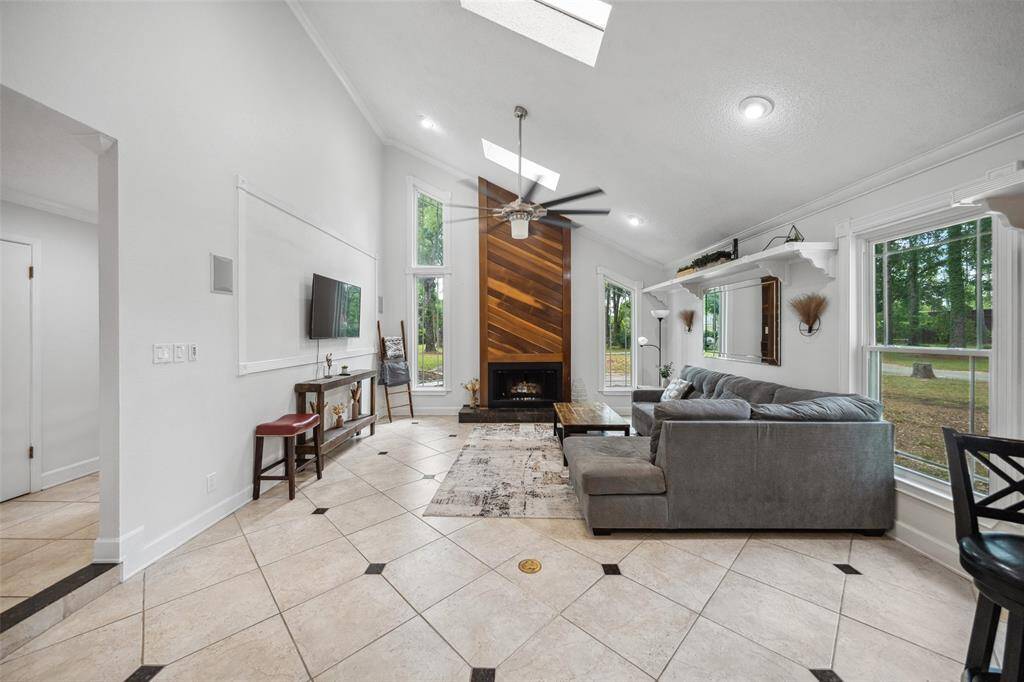 Step down into the sunken living/family room and relax with plenty of natural lighting and vaulted ceilings.