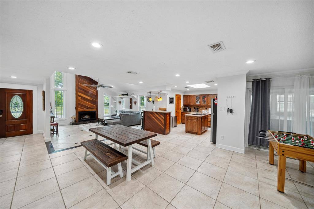 Family room is open and spacious to the kitchen and dining area.