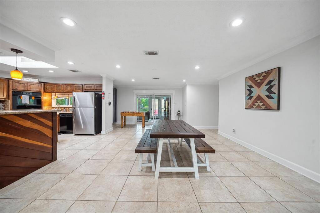 View of the dining and kitchen area from the family room.