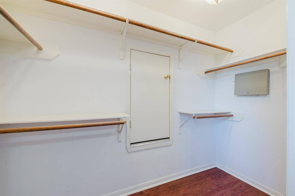 Walk-in closet off the primary bedroom, offering ample storage space.