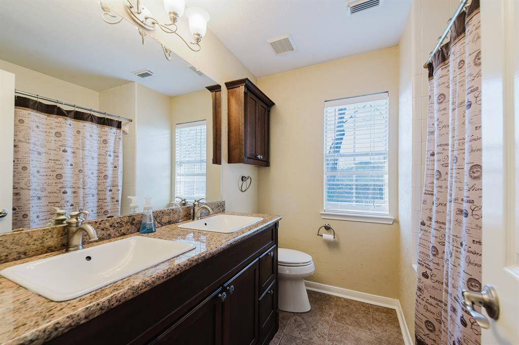 Another full bath, conveniently located for easy access and added comfort.