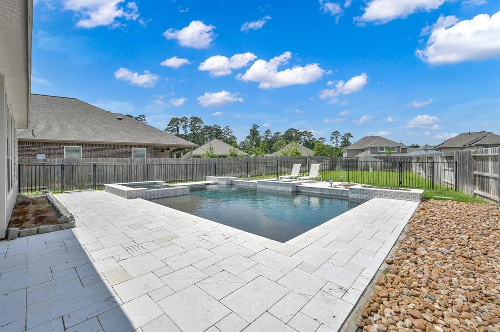 Heated pool with 3 fire features and waterfall