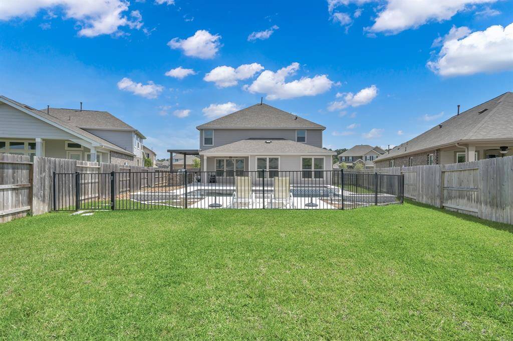 Extra backyard space beyond the pool