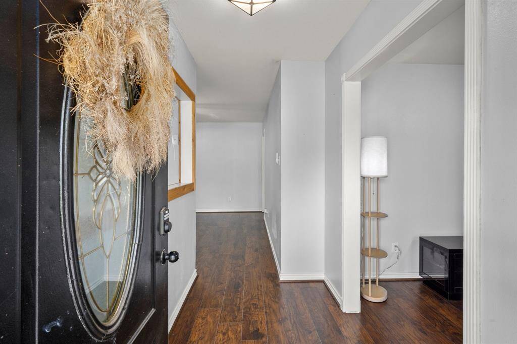 Hard flooring stretches throughout the living spaces and bedrooms.
