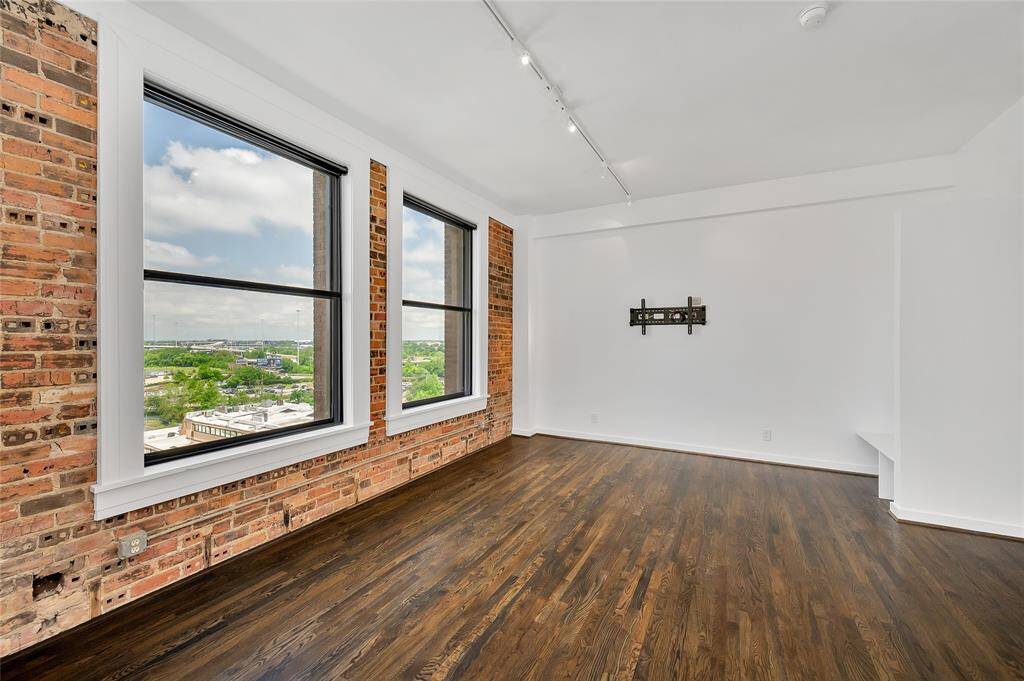 The Living area of Bayou Lofts 6E is very spacious for a smaller studio unit!  TV mount is ready for you to hang your TV and start living the urban dream!  Unit comes with 1 assigned parking space in building garage and an assigned storage cage in building garage (non-climate controlled).