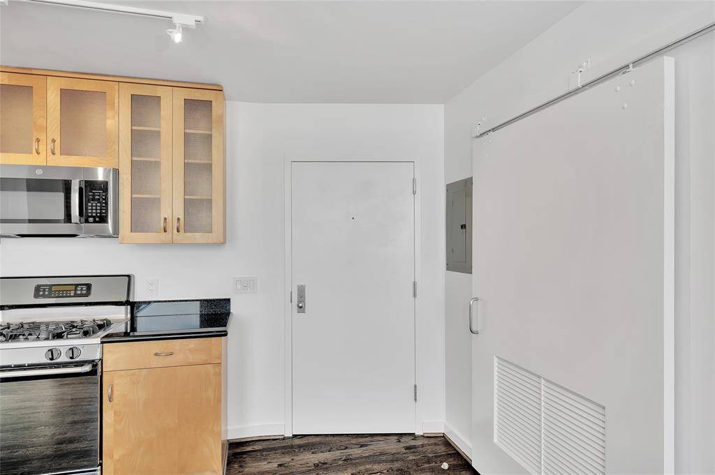 The Entry into Bayou Lofts 6E from building hallway is between the Kitchen and Laundry closet on right.  Monthly HOA fee of $681 includes water, sewer, trash, gas, fiber optic internet, common area maintenance & insurance, 24/7 Concierge, onsite Property Manager, gym and rooftop deck with splash pool!