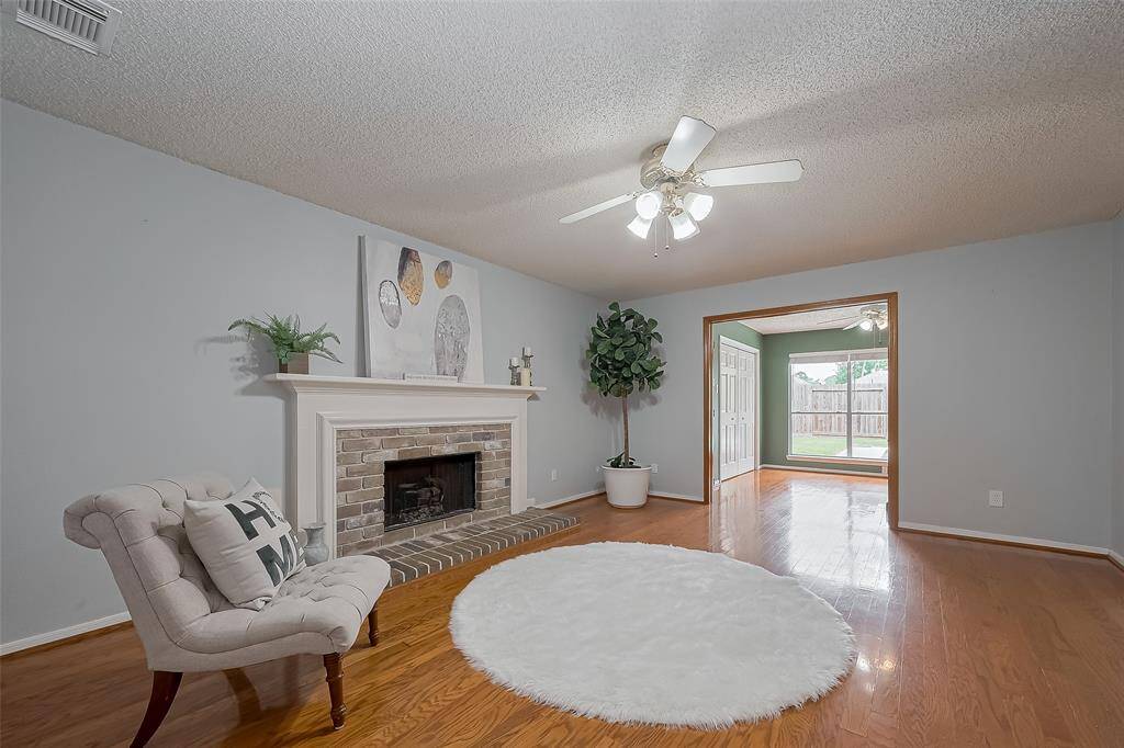 The family room features a cozy fireplace, creating a warm and inviting focal point for gatherings or quiet evenings at home.