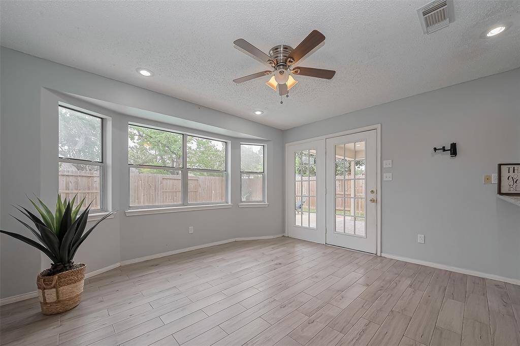 Whether you're preparing meals, entertaining guests, or enjoying quiet  evening at home, this bright and inviting space brings everyone together with ease. Natural light pours in through the sunroom, creating a warm and welcoming atmosphere throughout the main living areas.