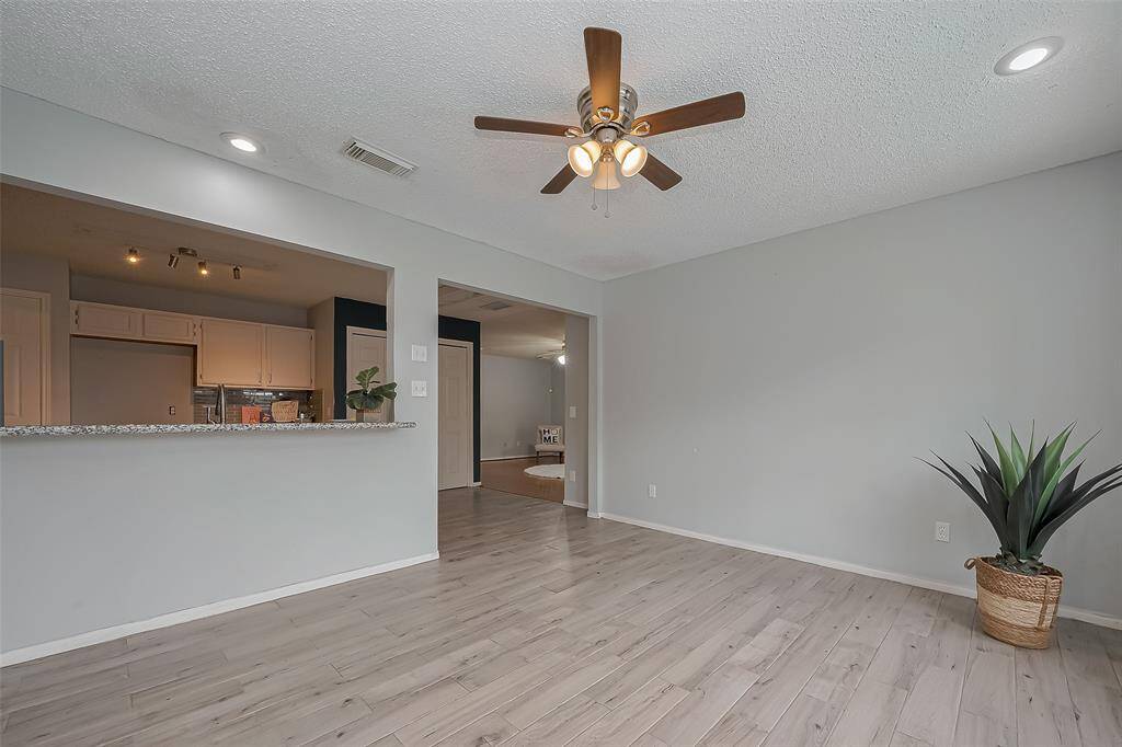 The view of the open concept into the kitchen and to the Family room.