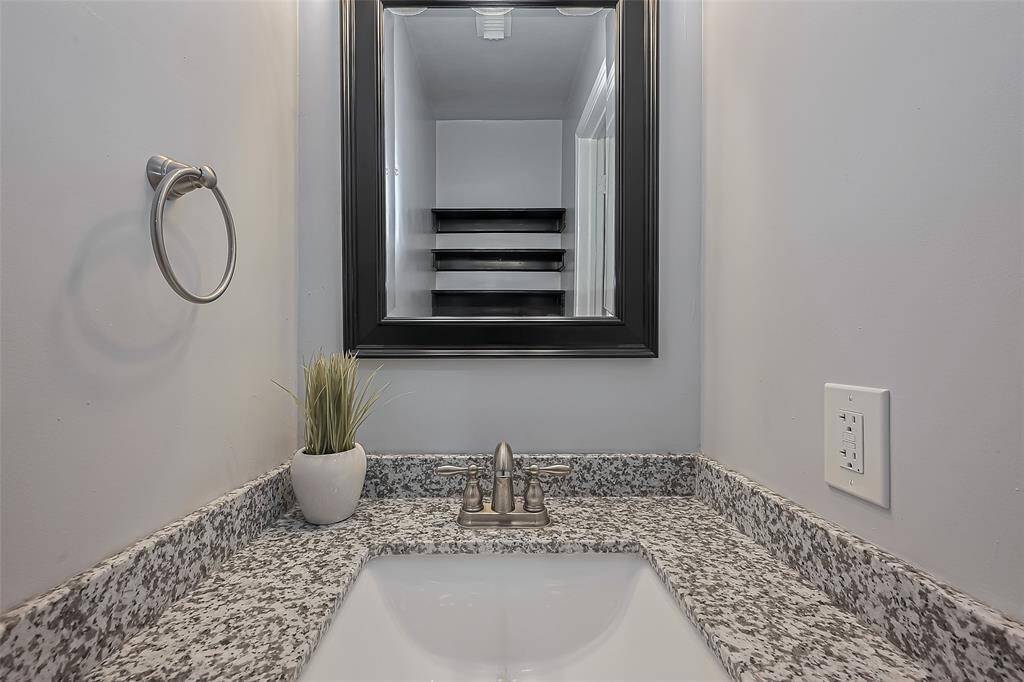 An updated half bath is convenient for downstairs guests