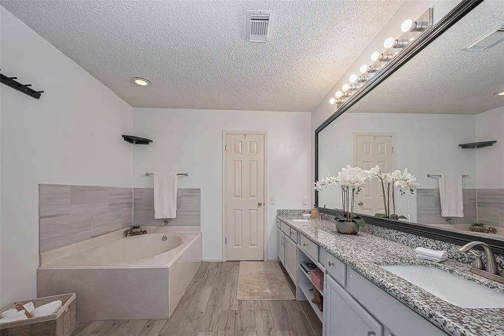 The large Primary Bath has a garden tub and a separate shower to enjoy
