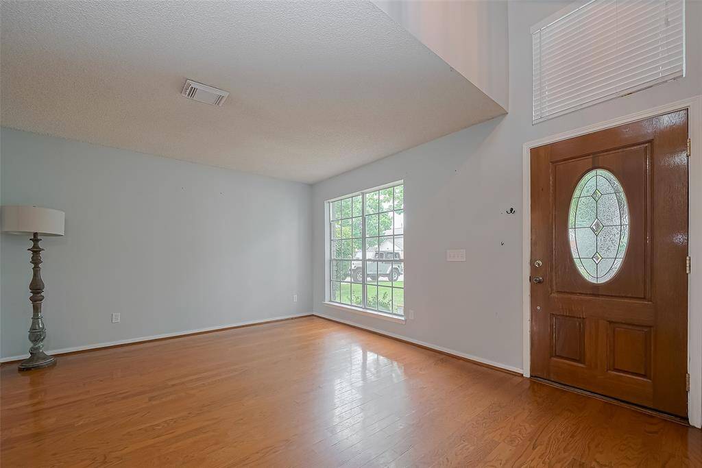 The front door entry opens to the Living Room