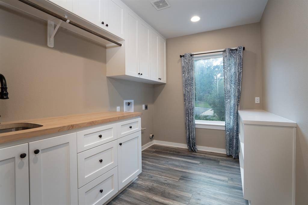 Laundry also has a sink and butcher block counters.