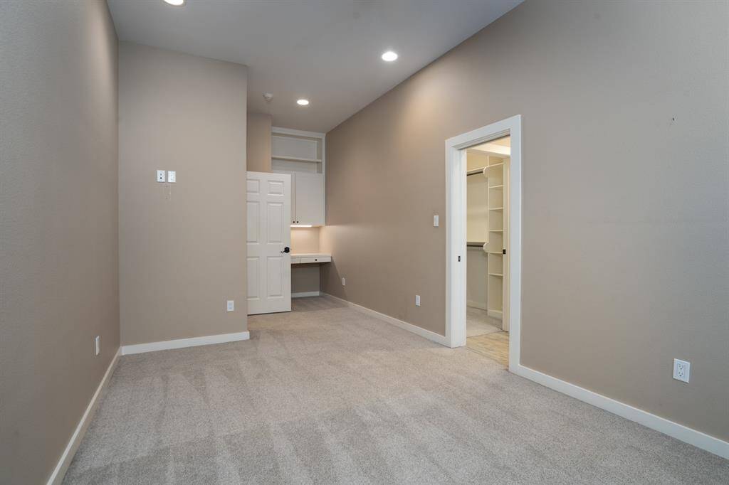 This second bedroom has a bult-in desk area.