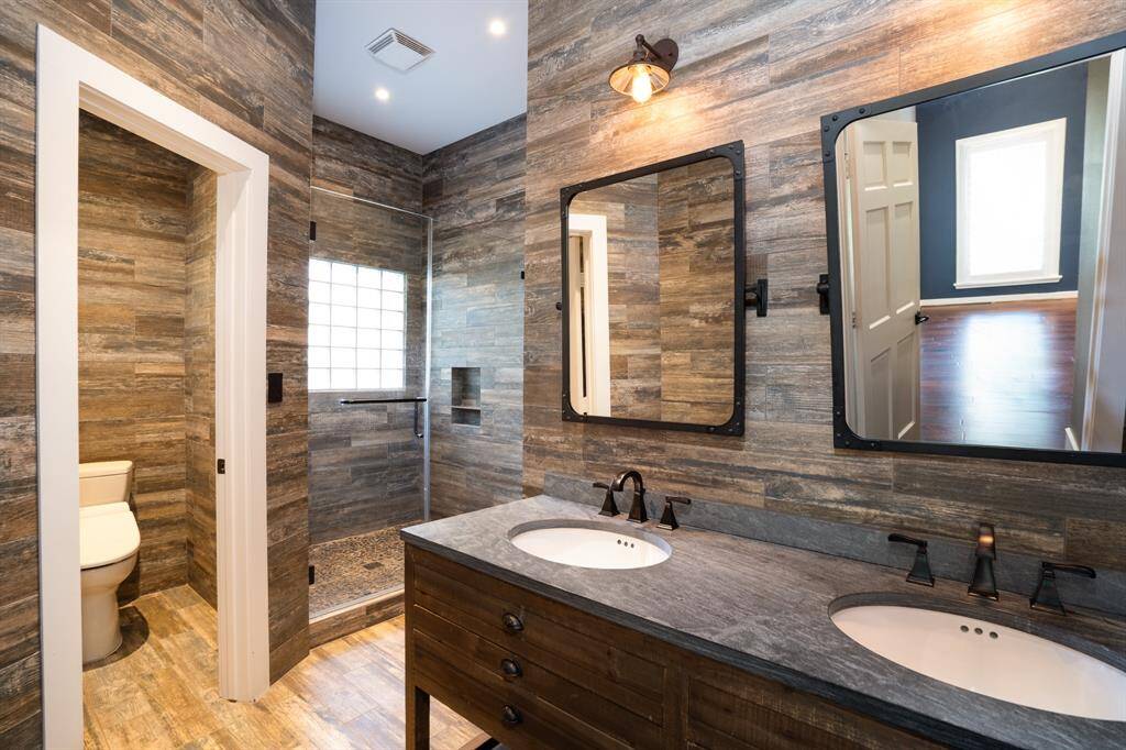 Primary bath is a tranquil retreat with double sink vanity and mirrors.