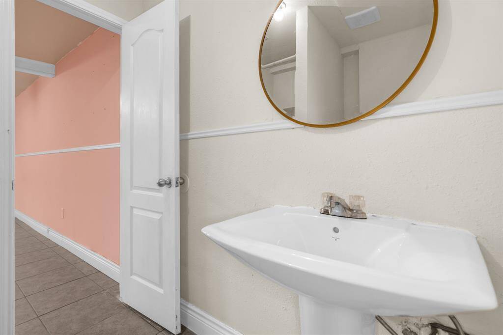 Full bathroom with standing shower in unit 2.