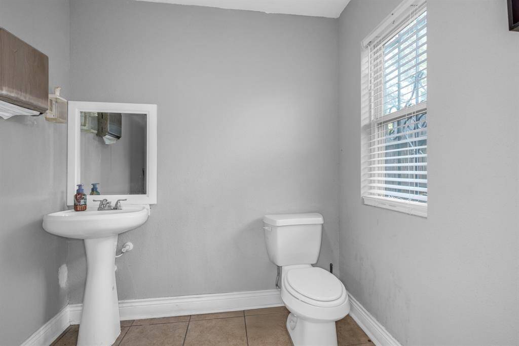 Bathroom and sink inside beauty salon (Unit #1).