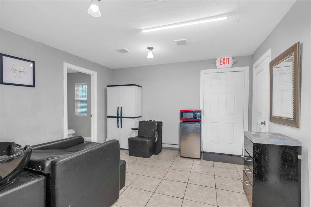 Back of beauty salon with back door exit. (Unit #1).