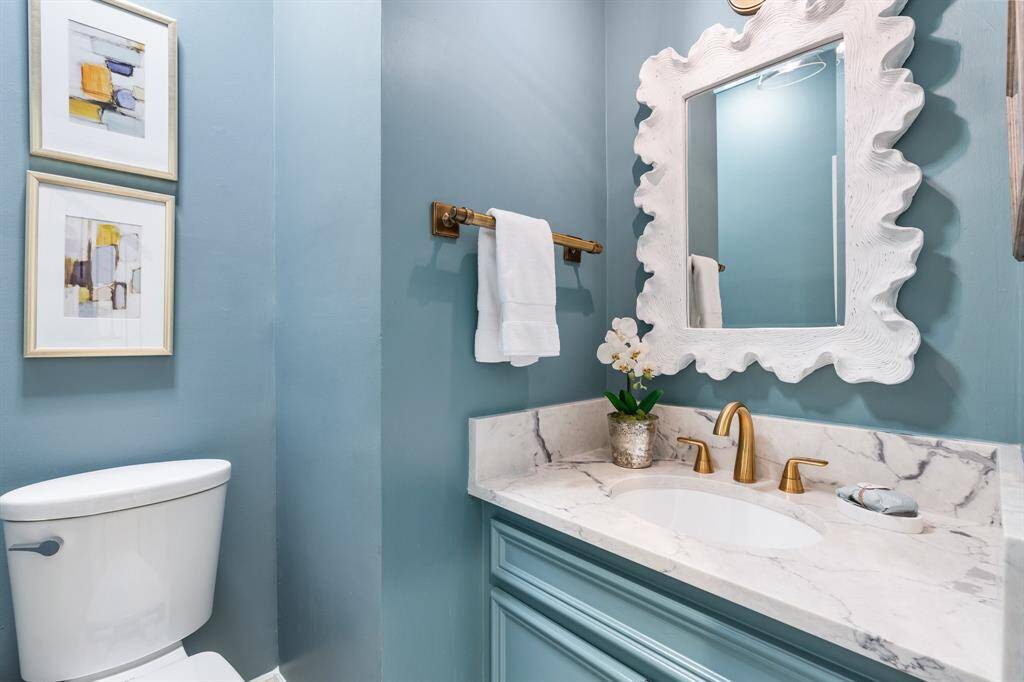 Half bath has also been remodeled with marble counters, new hardware and recent paint.