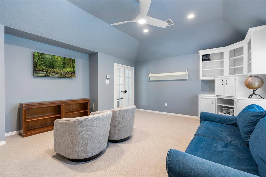 A versatile flex space that is light, bright, and generously sized for gaming tables, media seating, and convenient toy storage.
